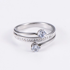 Elegant silver multi-layer spiral ring featuring large cubic zirconia stones on white background