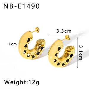 Detail view of 18K gold hollow heart hoop earrings with dimensions and 12g weight info