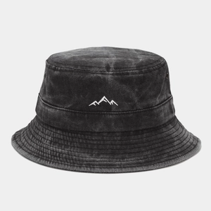 Close-up of mountain peak embroidery on black washed cotton bucket hat with eyelets