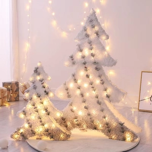Luminous flocked white Christmas tree set with warm LED lights for holiday home decor