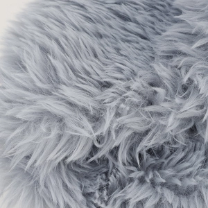 Macro detail of soft light gray faux fur plush material with long fluffy fibers