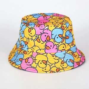 Detailed close-up of yellow bucket hat featuring colorful cartoon duck pattern prints