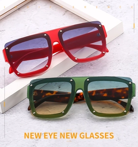 Detail of square oversized sunglasses with colorful gradient lenses and metal rivets