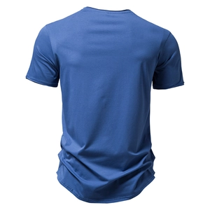 Back view of a plain dark blue cotton T-shirt with a round neck in a flat lay style