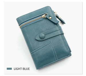 Detail of light blue PU leather wallet with gold buckle and precise stitching accents
