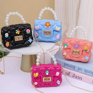 Mini silicone crossbody bags for kids with pearl handles and colorful cartoon patches