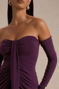 Close-up of ruched design and texture on a slim fit dark purple off-shoulder dress