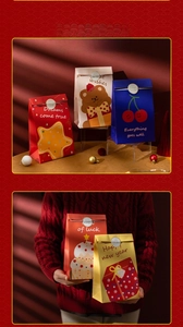 Detail of festive paper gift bags with teddy bear prints and gold seals for holidays
