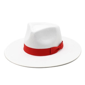 Close-up of white wool fedora hat with a bright red satin ribbon and side bow detail
