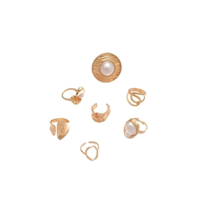 Set of 7 gold-toned rings featuring pearl accents and pleated geometric textures