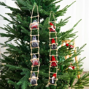 Hanging Christmas gnome dolls on rope ladder with red and grey felt outfits for decor