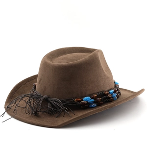 Detailed view of dark brown suede western hat with colorful beaded band and fringe trim