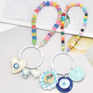 Handmade beaded keychain with evil eye charms and sweetheart heart pendants