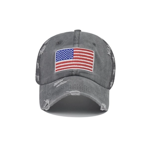 Macro shot of distressed cotton baseball cap with American flag patch and star detail