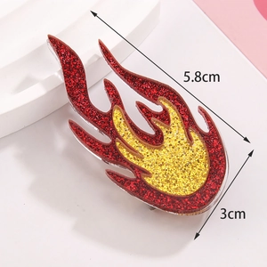 Macro view of 5.8cm x 3cm red and yellow gradient acrylic fire brooch with glitter