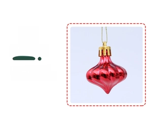Detailed view of onion-shaped red ornaments with vertical stripe texture and golden caps