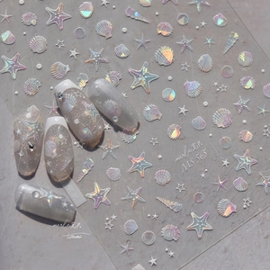 Macro detail of MS565 ocean series holographic nail stickers with shells and starfish