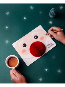 3D Christmas card with pop-up honeycomb Santa Claus and Merry Christmas text on green background