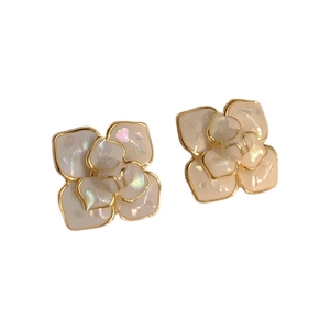Elegant white camellia flower stud earrings with gold plating and pearl finish