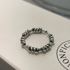Macro shot of S925 sterling silver twisted rope ring with vintage oxidized finish