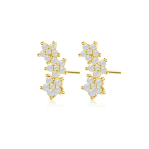 Elegant S925 silver gold-plated curved flower earrings with white gems on white background