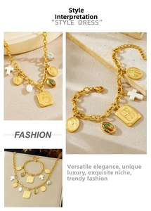 Close-up of gold plated jewelry set featuring cross charms and religious pendants