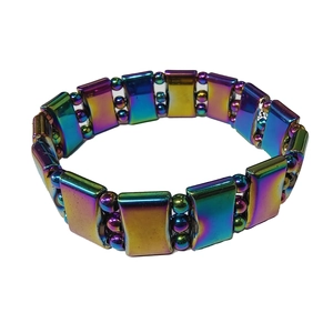 Close-up of colorful magnetic hematite beads with metallic finish on elastic yoga bracelet