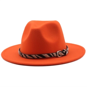Detail of orange felt fedora with zebra print leather band and silver buckle