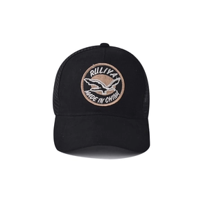 Detail of embroidered bird patch on black breathable mesh trucker baseball cap
