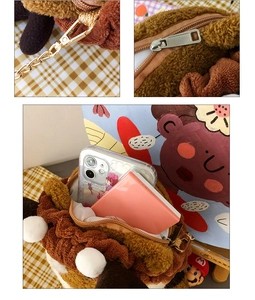 Detail view of Shiba Inu plush bag showing metal chain, zipper and interior capacity