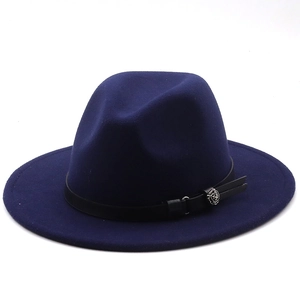 Detail view of navy blue wool fedora hat featuring black leather band and silver flower buckle