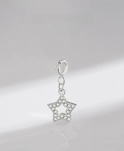 Macro shot of S925 sterling silver hollow star pendant with shimmering pave-set stones