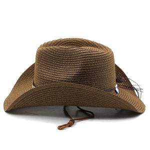 Detail of a brown woven straw cowboy hat featuring a drawstring and fine texture