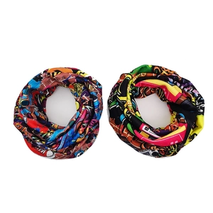 Close-up of seamless neck gaiter set with vibrant 90s graffiti art print on elastic fabric
