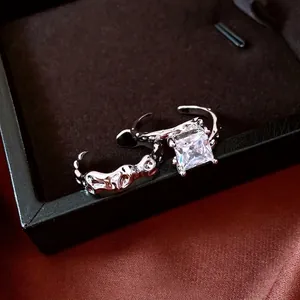 Lava texture silver rings set with square zircon stone on velvet jewelry box