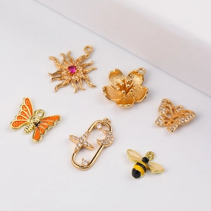 DIY jewelry charms including bee butterfly and star shapes in gold plated alloy finish