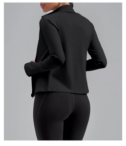 Detail view of slim fit black yoga jacket with high neck zipper and seamless stitching