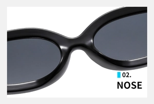 Detail view of the ergonomic nose pad design on black oval retro sunglasses