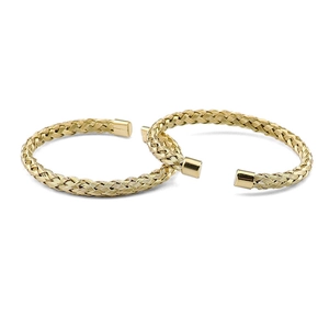Detailed view of golden woven texture on stainless steel open bangle with smooth ends