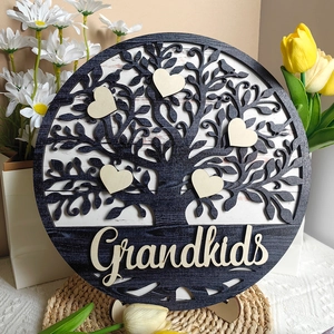 Detail of wooden Grandkids heart plaques and Tree of Life on circular decor sign