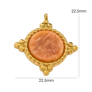 Detail of 22.5mm round orange natural stone pendant with gold beaded diamond frame