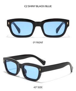 Vue détaillée des lunettes de soleil noires rectangulaires avec verres bleus et rivets