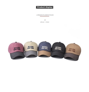 Detail display of five multi-color washed cotton baseball caps with New York embroidery