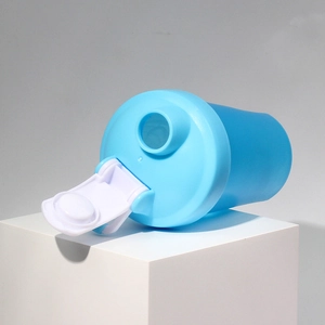 Detailed close-up of blue protein shaker bottle with white flip-top lid on studio stand