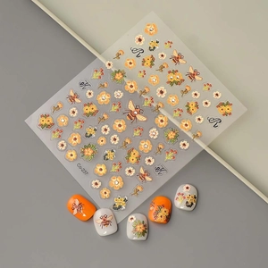 Detailed view of Co-237 bee and floral 5D embossed nail art stickers with orange flower motifs