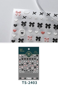 Macro shot of 3D embossed nail stickers featuring pink bows, hearts, and pearl textures