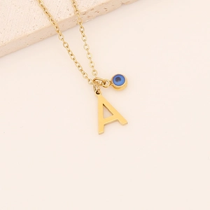 Golden stainless steel necklace featuring letter A and blue evil eye bead charms