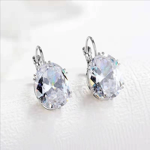 Elegant lever-back earrings with oval-cut clear gemstones in a polished silver setting