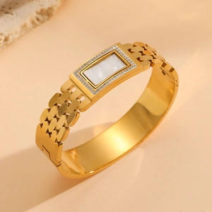 18K gold plated titanium bangle featuring white mother-of-pearl and crystal pavé accents