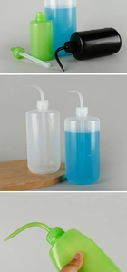 Detailed view of graduated 1000ml plastic squeeze bottles with curved spray nozzles